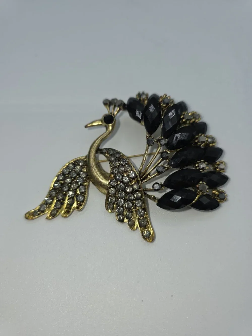 Gold-Tone Peacock Brooch With Rhinestone Wings & Black Gemstone Tail Feathers
